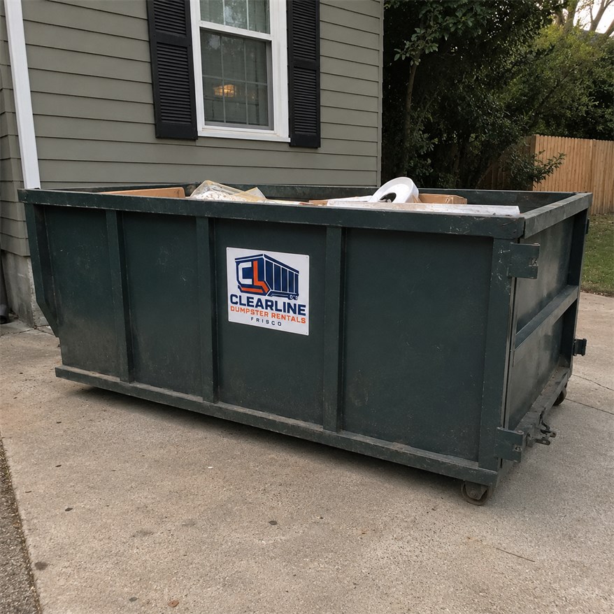 Dumpster Rentals Frisco Clearline roll-off dumpster rental container part-loaded on a driveway